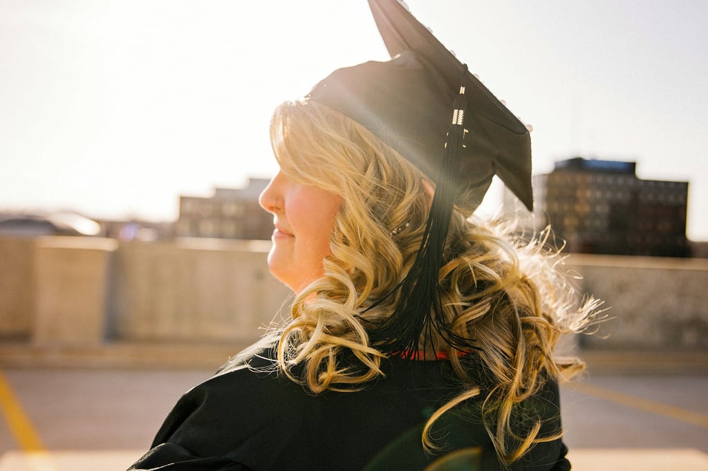 Student standing in graduation regalia. 