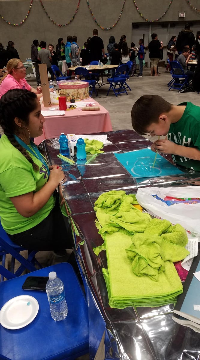 A child works on a mathematical art project.