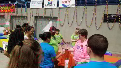 Participants pass a bottle of water to each other.