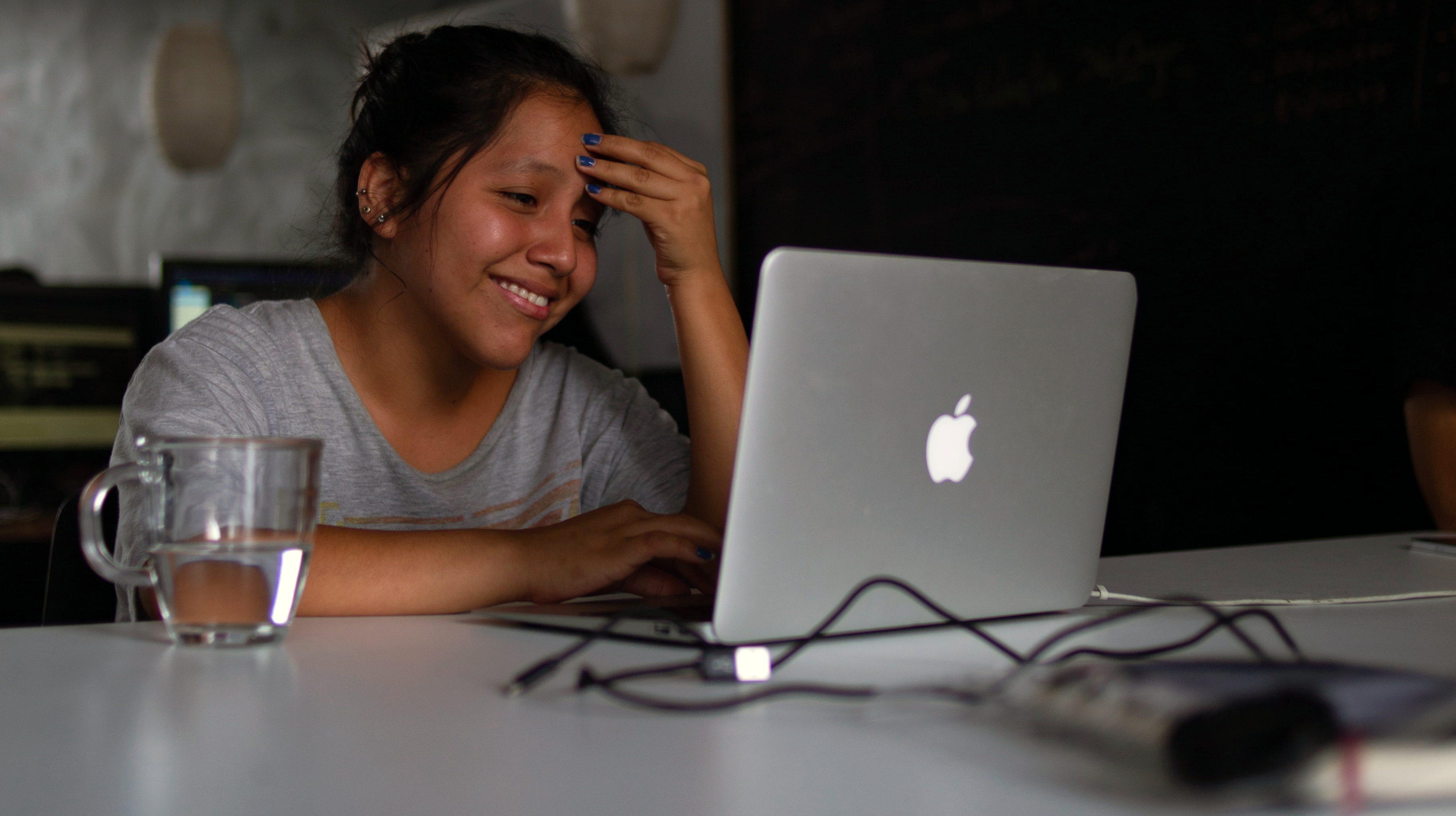 Stressed out woman looking at her opened laptop.